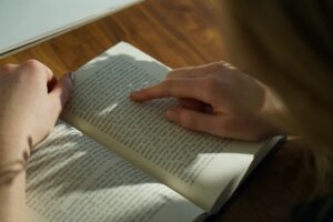 Close up shot of a lady reading a book