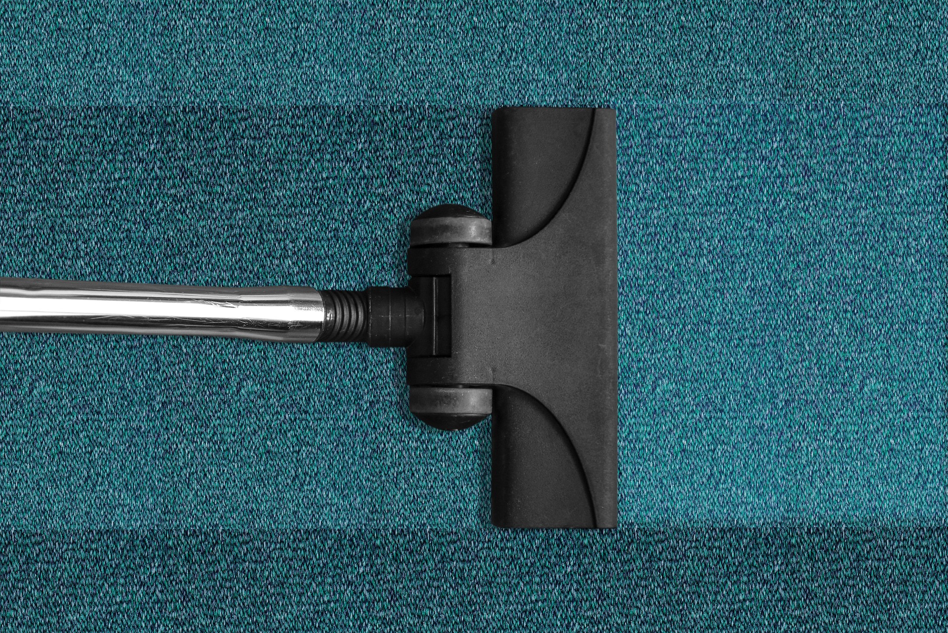 Image of vacuum cleaner on a blue carpet