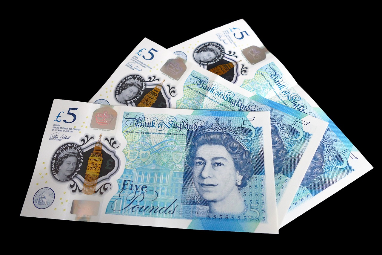 Three UK five pound notes